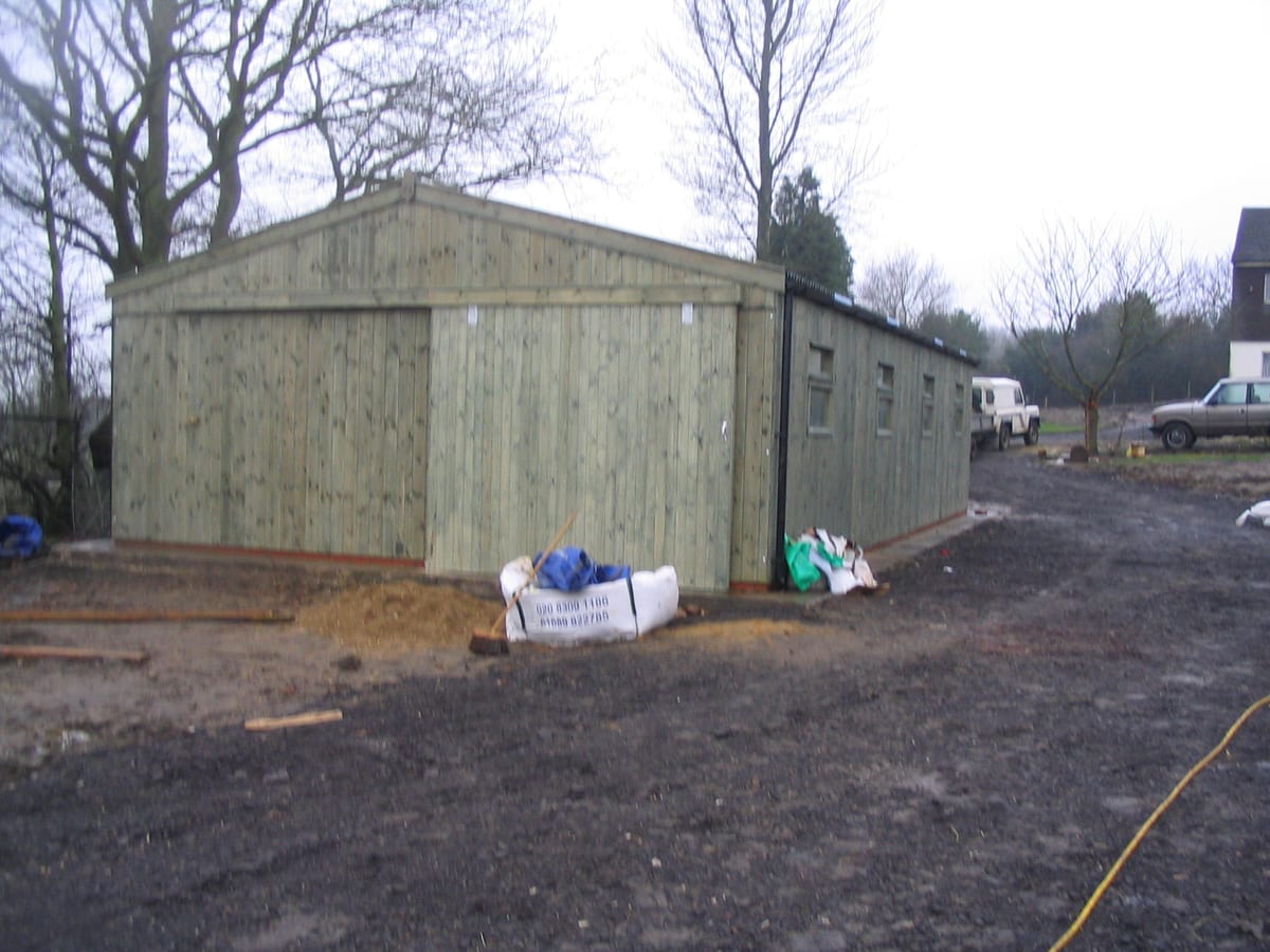 Pressure treated timber American barn with windows along the side