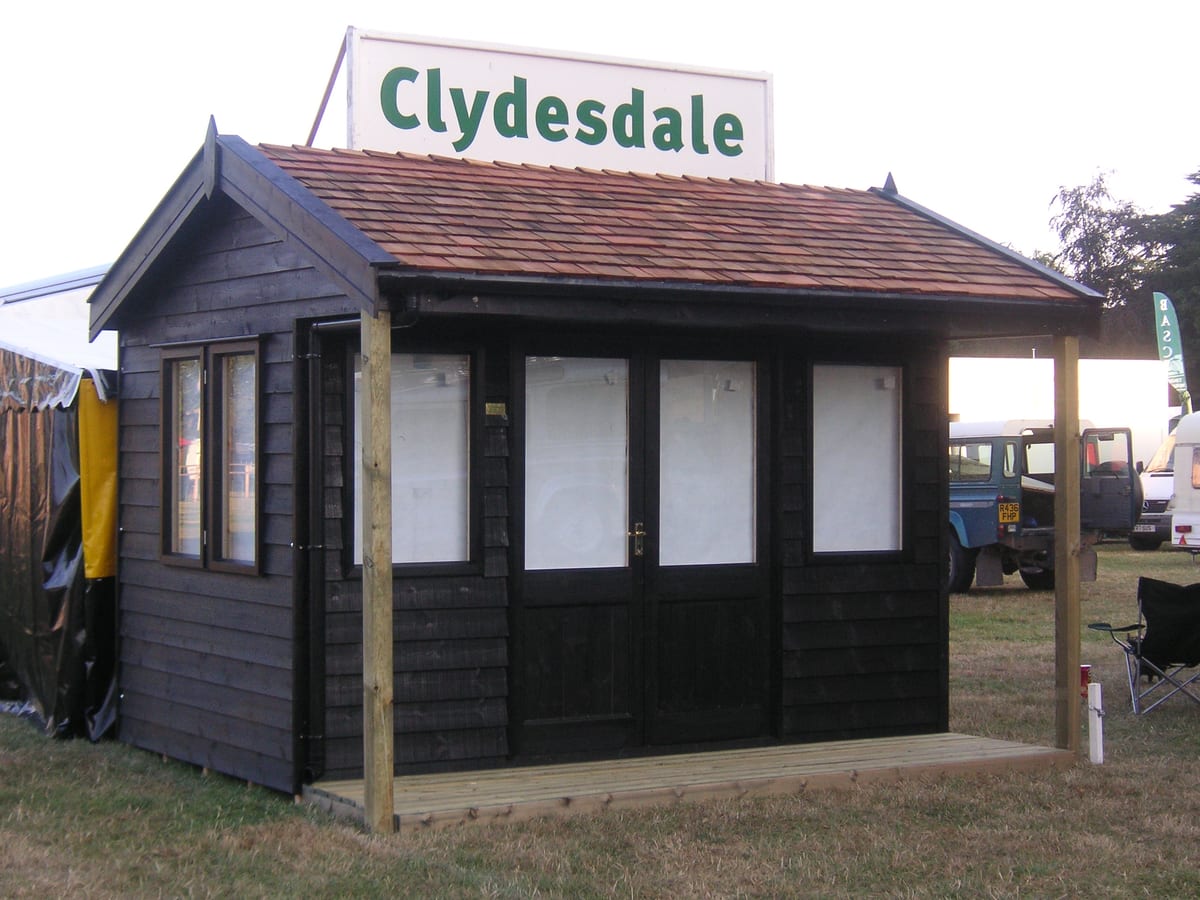 Garden building with a cedar shingle roof and covered verandah