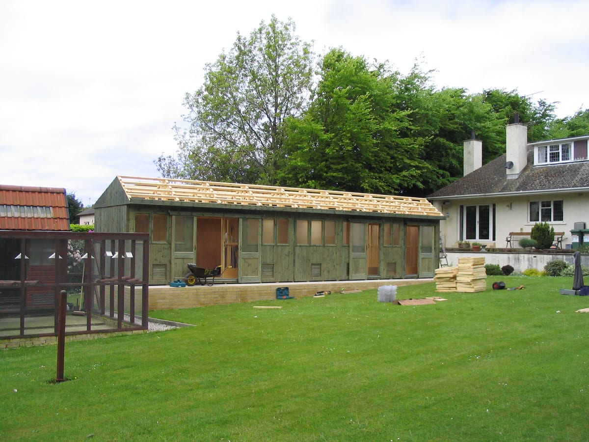 Pigeon loft finished in a green stain