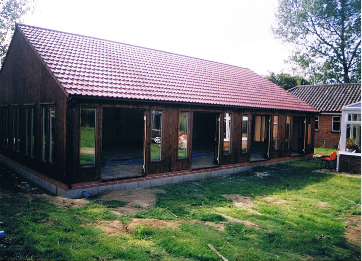 Timber pool enclosure with a tiled roof