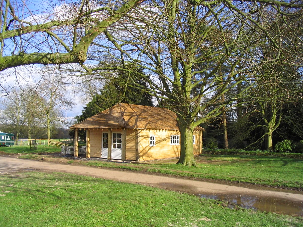 Timber visitor reception building in parkland