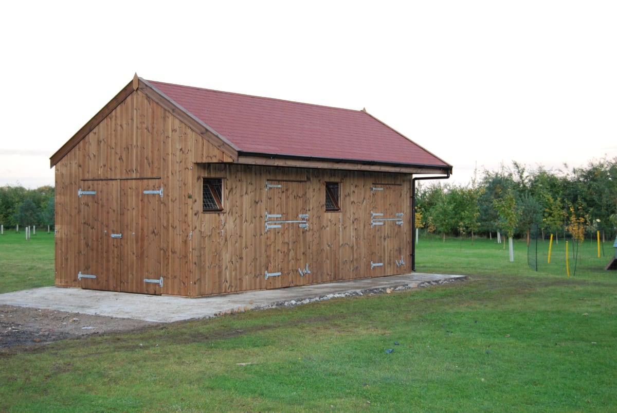 Combination timber stables and hay store